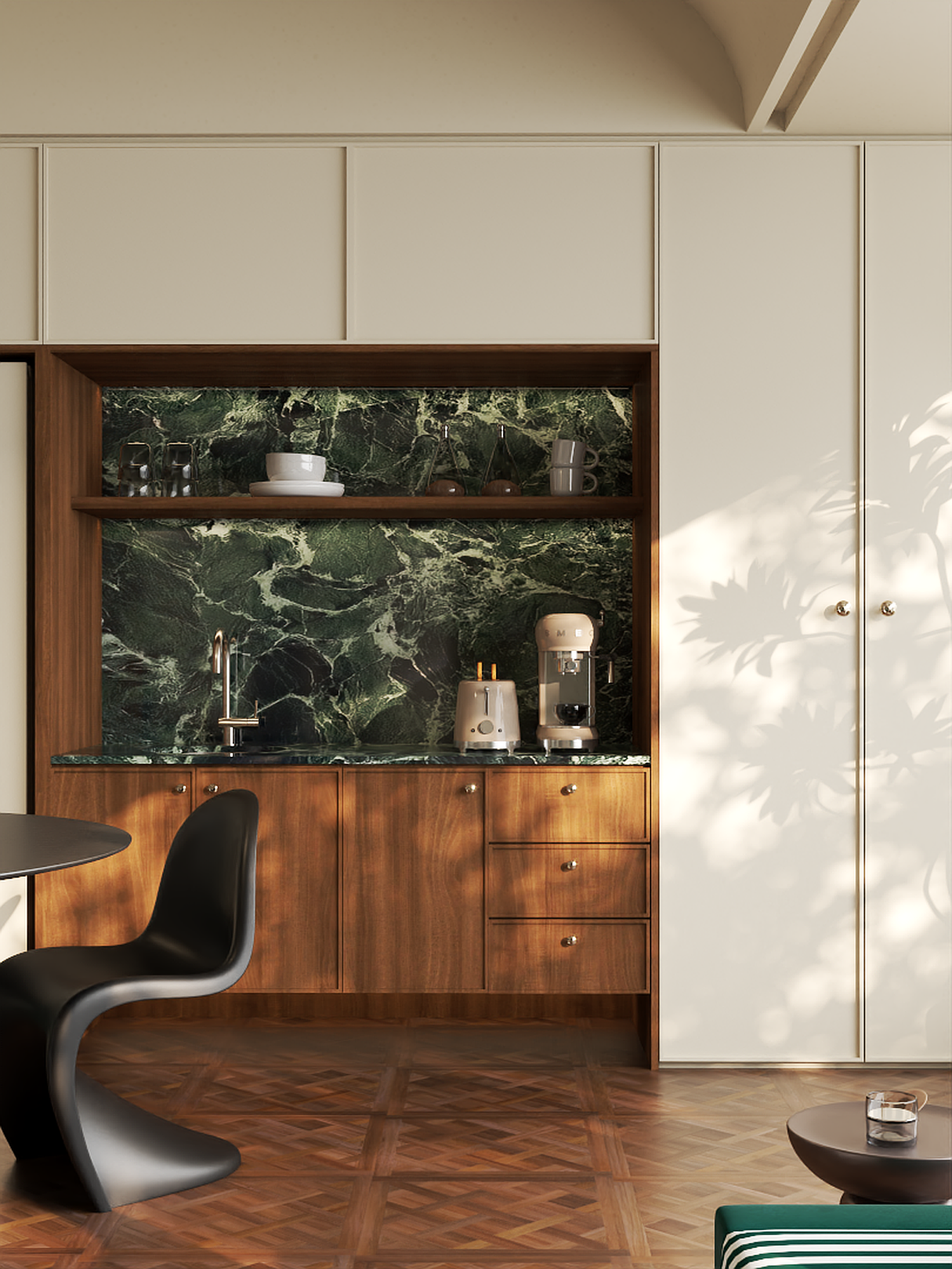 A built-in coffee bar with walnut cabinet fronts, a green marble surround and full-height cream wall cabinets