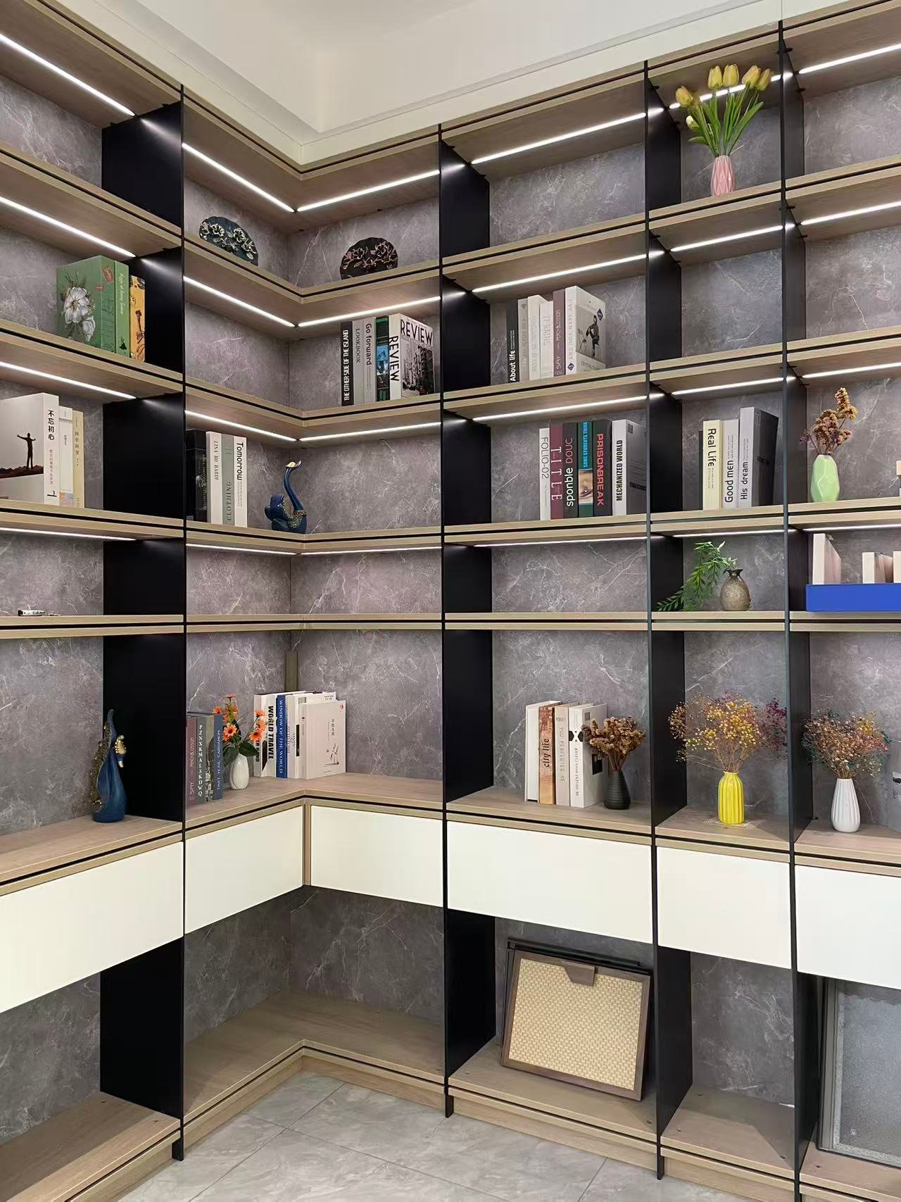 Corner floor-to-ceiling aluminum display shelving with LED-lit shelves and gray marble back panels