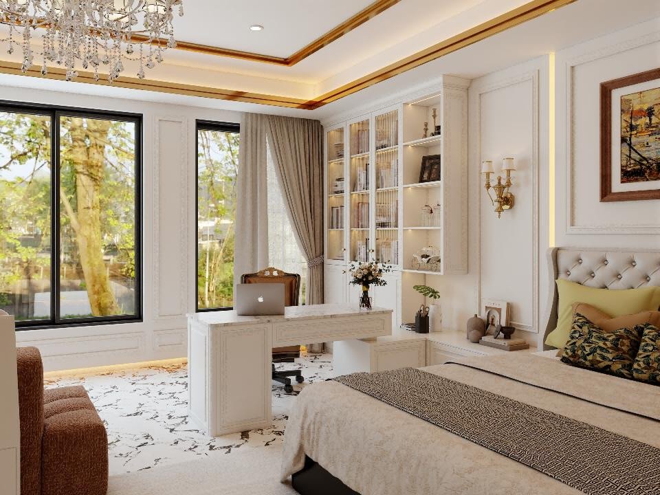 Bedroom with an integrated desk and a wall of glass-fronted bookshelves in a white cabinet finish